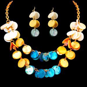 Multi color shell necklace and earring set in blue, beige, and white shell disk